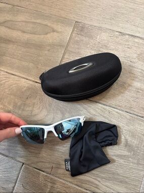 Oakley White Frame Sunglasses with Blue Mirrored Lenses